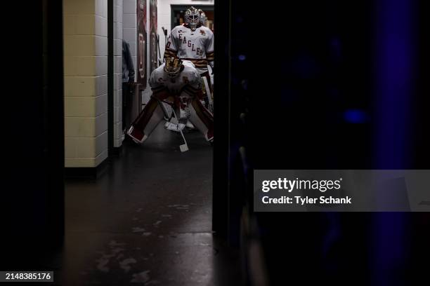 Jacob Fowler of the Boston College Eagles prepares to lead his team on the ice before the game against the Michigan Wolverines during the Division I...