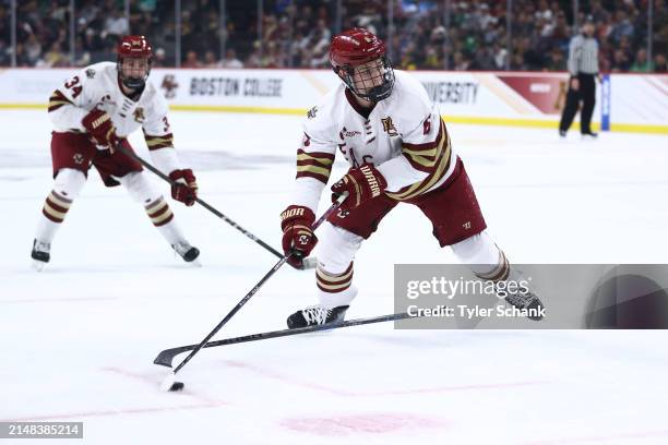 Will Smith of the Boston College Eagles looks to make a shot on goal against the Michigan Wolverines during the Division I Mens Ice Hockey Semifinals...