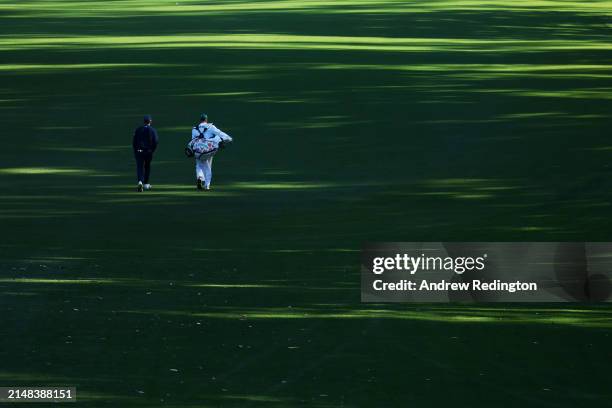 Nicolai Højgaard of Denmark walks the 18th fairway during the continuation of the first round of the 2024 Masters Tournament at Augusta National Golf...