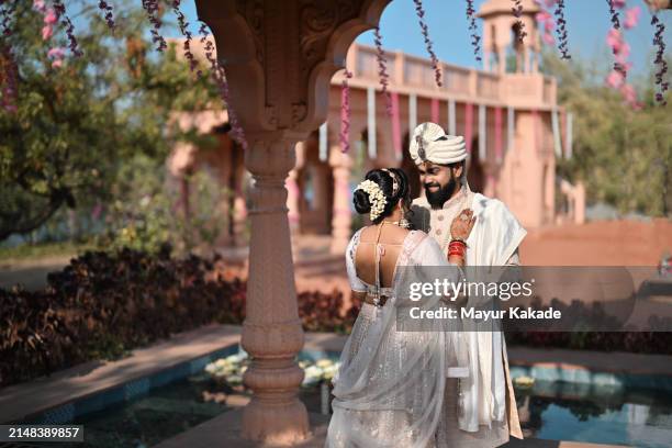 bride and groom's candid intimate moment at the palace - destination wedding stock pictures, royalty-free photos & images