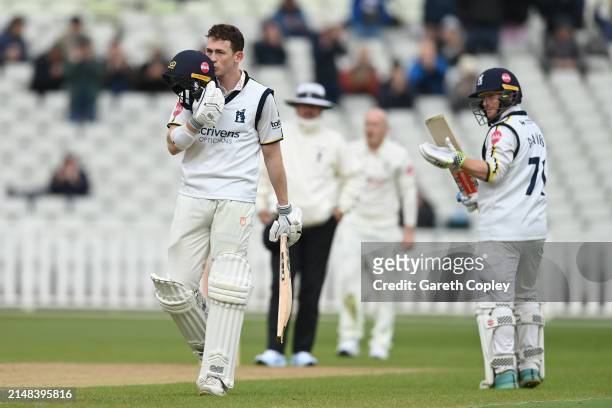 Rob Yates of Warwickshire celebrates reaching his century during day one of the Vitality County Championship Division One match between Warwickshire...