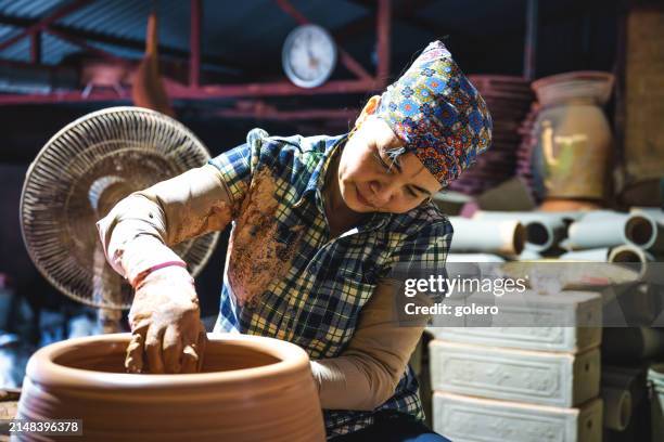 woman making jar at pottery wheel - east asian works of art specialist stock pictures, royalty-free photos & images