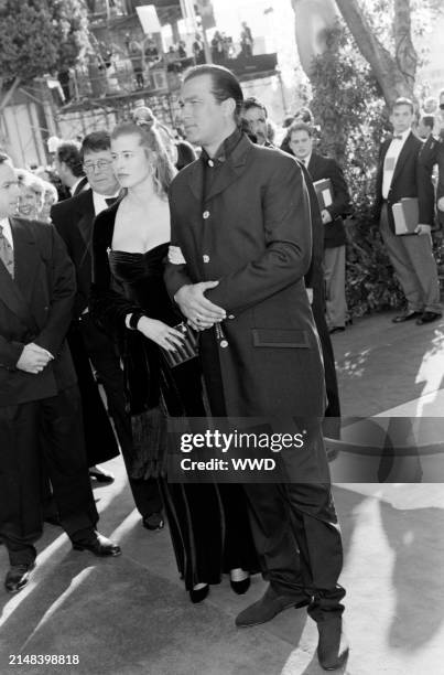 Actor Steven Seagal and Arissa Wolf attend the 68th Annual Academy Awards at the Dorothy Chandler Pavilion in Los Angeles, California on March 25,...