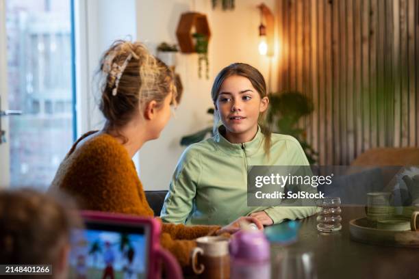 mother and daughter at breakfast - the youths stock pictures, royalty-free photos & images
