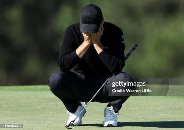 Jordan Spieth of the United States reacts on the 18th green during the continuation of the first round of the 2024 Masters Tournament at Augusta...