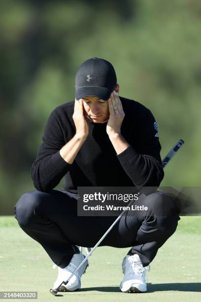 Jordan Spieth of the United States reacts on the 18th green during the continuation of the first round of the 2024 Masters Tournament at Augusta...