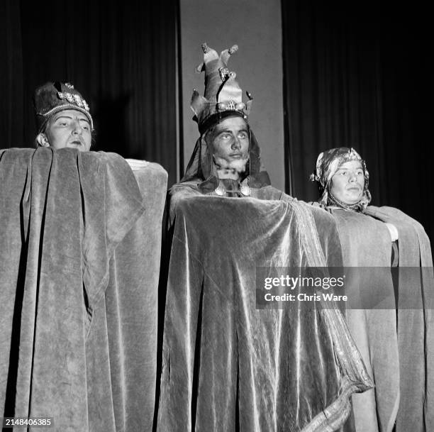 Schoolgirls Jean Charrington, in costume as Caspar, Enid Ensor as Melchior, and Pamela Hutton as Balthazar during a performance of the Nativity at...
