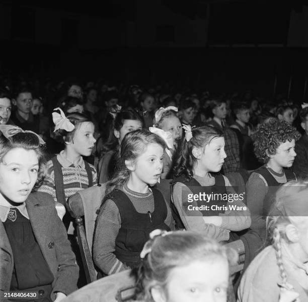 Schoolchildren from neighbouring schools watch the dress rehearsal of the Nativity at Tottenham High School for Girls in Haringey, London, England,...
