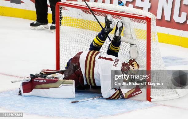 Garrett Schifsky of the Michigan Wolverines crashes into Jacob Fowler of the Boston College Eagles in the third period during the NCAA Mens Hockey...