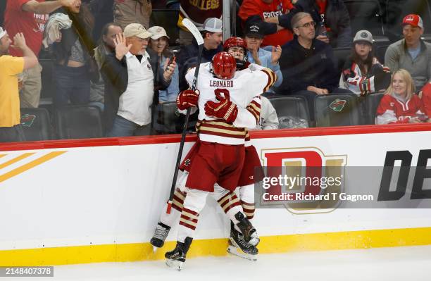 Cutter Gauthier of the Boston College Eagles celebrates his goal against the Michigan Wolverines with teammate Ryan Leonard in the second period...