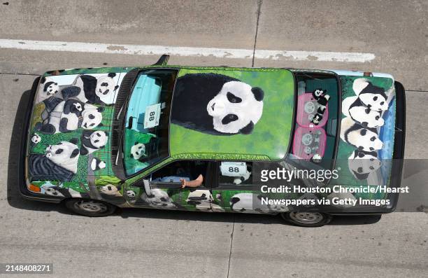 An art car dedicated to pandas makes its way through downtown Houston during the 36th Annual Houston Art Car Parade on Saturday, April 15, 2023.