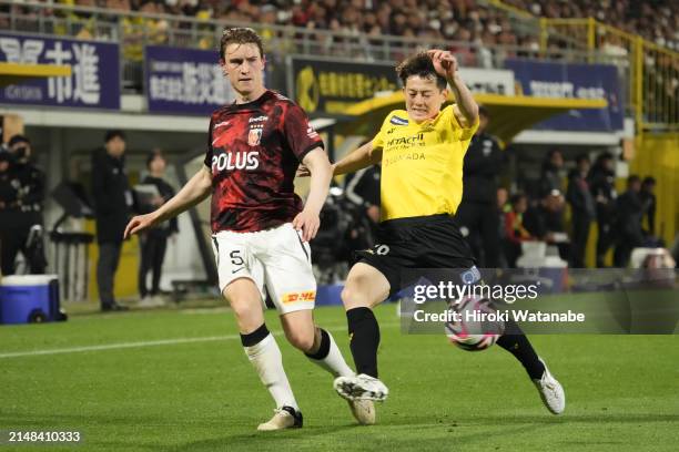 Sachiro Toshima of Kashiwa Reysol and Marrius Hoibraten of Urawa Red Diamonds compete for the ball during the J.LEAGUE MEIJI YASUDA J1 8th Sec. Match...