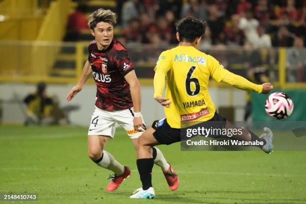 Yuto Yamada of Kashiwa Reysol and Hirokazu Ishihara of Urawa Red Diamonds compete for the ball during the J.LEAGUE MEIJI YASUDA J1 8th Sec. Match...