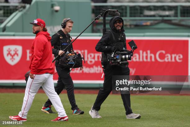 Netflix camera operator films during warms up before a game between the Boston Red Sox and the Baltimore Orioles at Fenway Park on April 11, 2024 in...