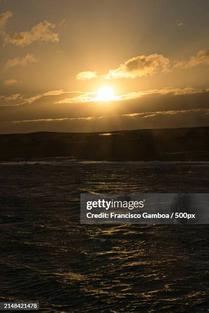 scenic view of sea against sky during sunset - francisco gamboa stock pictures, royalty-free photos & images