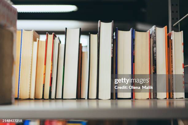 close up of library books in a row - online dictionary stock pictures, royalty-free photos & images
