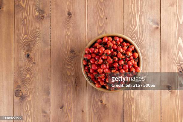 directly above shot of fruits in bowl on table - rosa eglanteria stock pictures, royalty-free photos & images