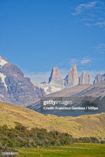 scenic view of landscape and mountains against blue sky - francisco gamboa stock pictures, royalty-free photos & images