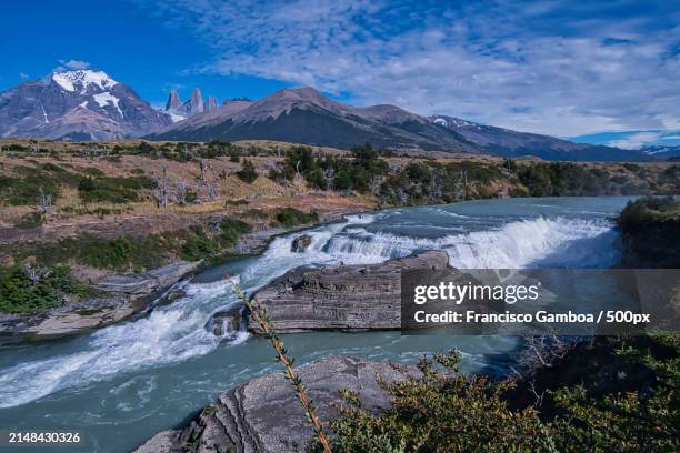 scenic view of river amidst mountains against sky - francisco gamboa stock pictures, royalty-free photos & images
