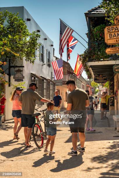 st. augustine florida people walk along saint george street in the historic district - high street stock-fotos und bilder