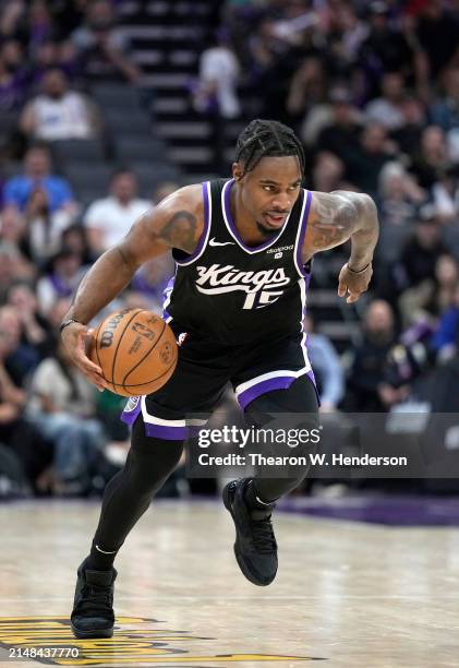 Davion Mitchell of the Sacramento Kings dribbles the ball against the New Orleans Pelicans during the second half of an NBA basketball game at Golden...