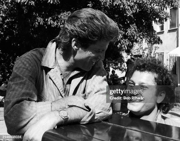 Actor Ted Danson and Actor Howie Mandel on set during filming of movie 'A Fine Mess' on April 2, 1985 in Los Angeles, California.
