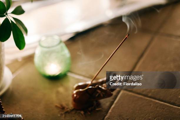 incense, perfumed burning sticks, candle. ritual attributes of a mystical spiritual seance - candlelight ceremony stock pictures, royalty-free photos & images