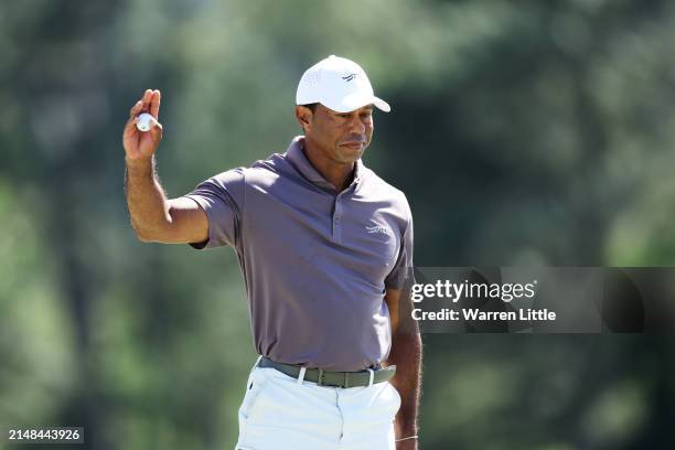 Tiger Woods of the United States reacts on the 18th green during the second round of the 2024 Masters Tournament at Augusta National Golf Club on...