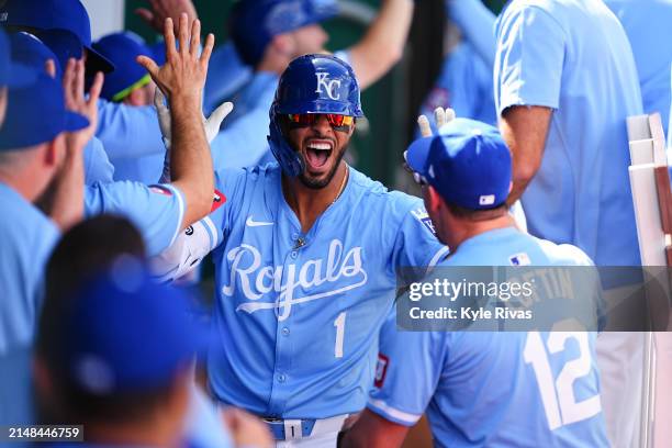 Melendez of the Kansas City Royals celebrates with teammates after hitting a home run against the Chicago White Sox during the seventh inning at...