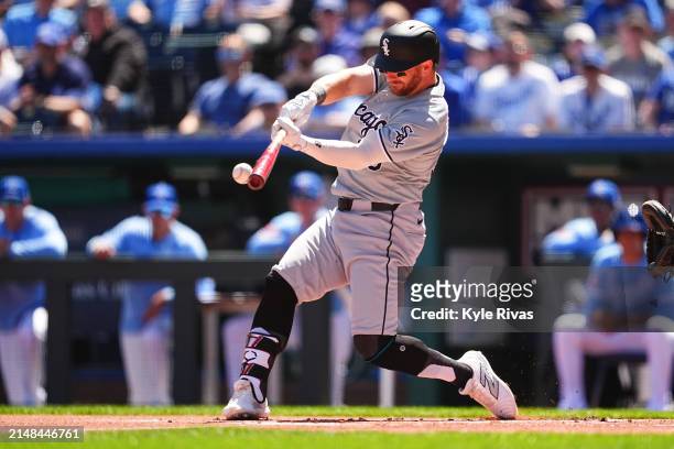 Robbie Grossman of the Chicago White Sox connects with a Kansas City Royals pitch during the first inning at Kauffman Stadium on April 7, 2024 in...