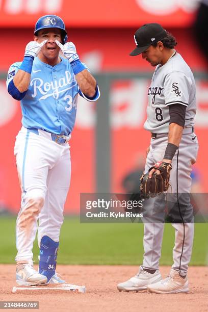 Freddy Fermin of the Kansas City Royals celebrates at second after connecting with a Chicago White Sox pitch during the seventh inning at Kauffman...
