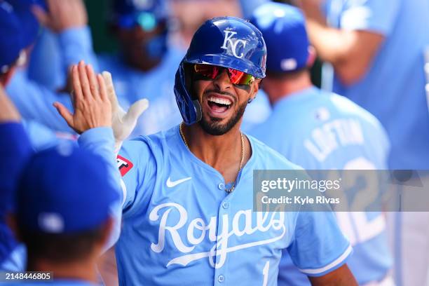 Melendez of the Kansas City Royals celebrates with teammates after hitting a home run against the Chicago White Sox during the seventh inning at...