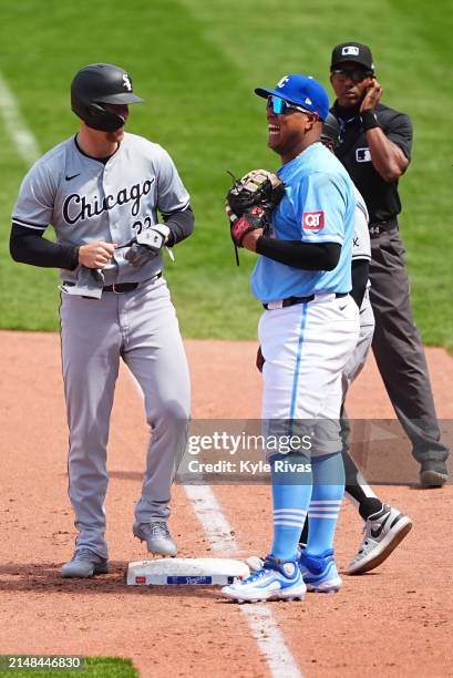 Salvador Perez of the Kansas City Royals chats with Andrew Benintendi of the Chicago White Sox during the fifth inning at Kauffman Stadium on April...