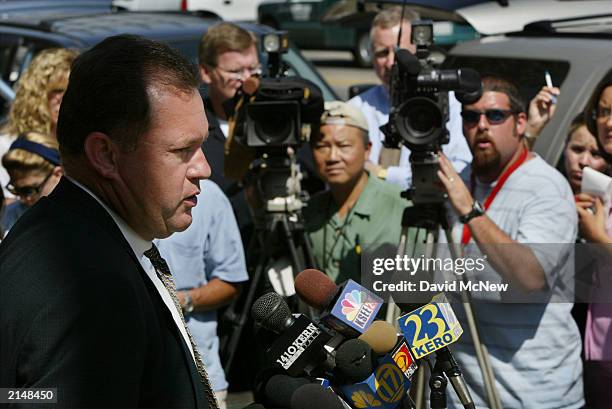Bakersfield Police Capt. Neil Mahan speaks during a press conference about the discovery of a murdered family of five July 9, 2003 in Bakersfield,...