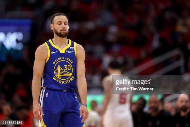Stephen Curry of the Golden State Warriors reacts in the second half against the Houston Rockets at Toyota Center on April 04, 2024 in Houston,...