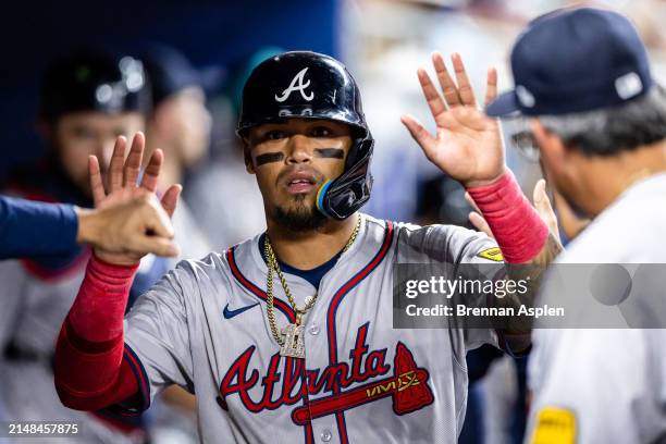 Orlando Arcia of the Atlanta Braves scores in the seventh inning against the Miami Marlins at loanDepot park on April 12, 2024 in Miami, Florida.