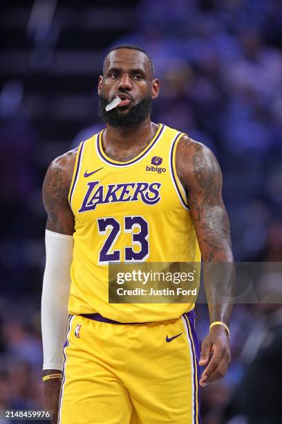 LeBron James of the Los Angeles Lakers looks on during the first half against the Memphis Grizzlies at FedExForum on April 12, 2024 in Memphis,...