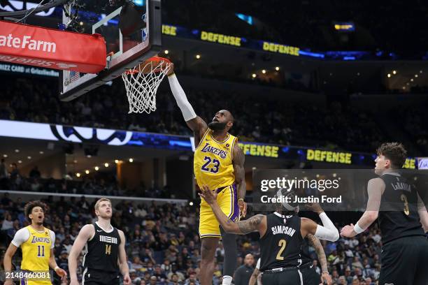 LeBron James of the Los Angeles Lakers goes to the basket during the game against Zavier Simpson of the Memphis Grizzlies at FedExForum on April 12,...