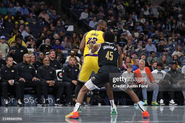 LeBron James of the Los Angeles Lakers handles the ball against GG Jackson of the Memphis Grizzlies during the first half at FedExForum on April 12,...