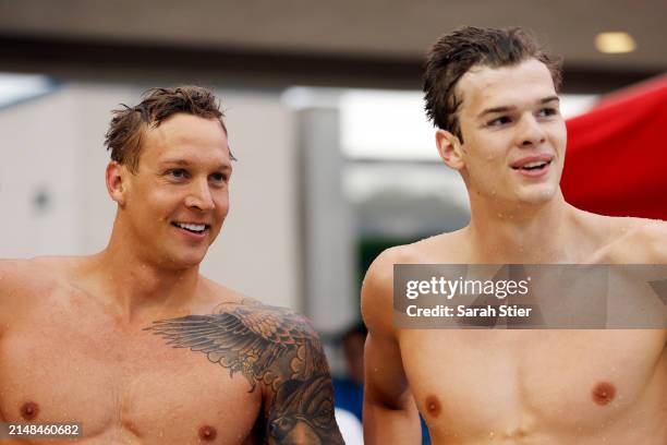 Caeleb Dressel reacts with Hubert Kos after they tied for first place in the Women's 100m Butterfly final on Day 3 of the TYR Pro Swim Series San...