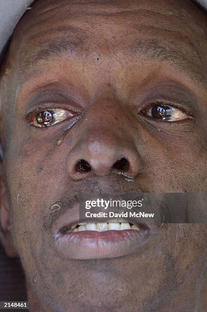 Vernon Page weeps while talking to the press about the kindness of his close personal friend Earnestine Harper, who was among a family of five found...