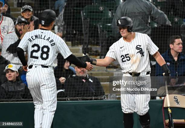 Zach Remillard of the Chicago White Sox is congratulated by Andrew Vaughn of the Chicago White Sox after he scored during the third inning of a game...