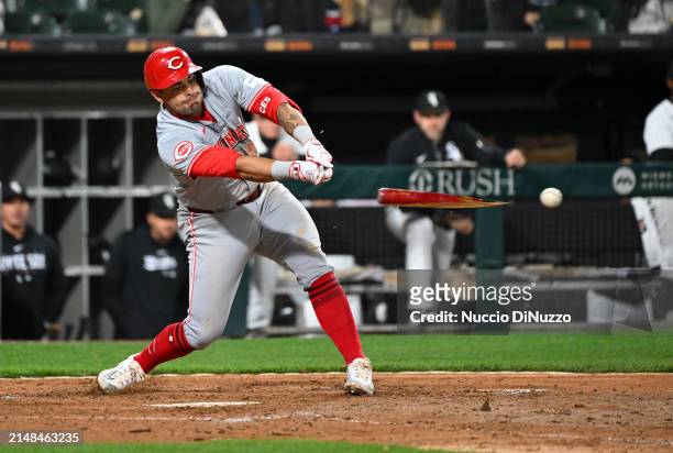 Christian Encarnacion-Strand of the Cincinnati Reds hits a two RBI single during the eighth inning of a game against the Chicago White Sox at...