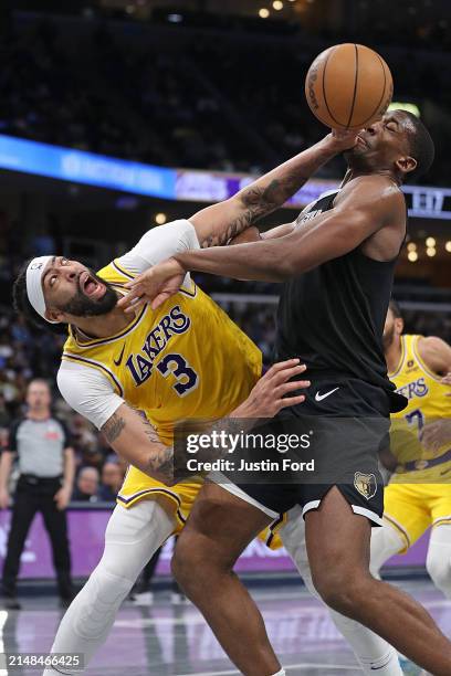 Anthony Davis of the Los Angeles Lakers and Trey Jemison of the Memphis Grizzlies fight for the ball during the second half at FedExForum on April...