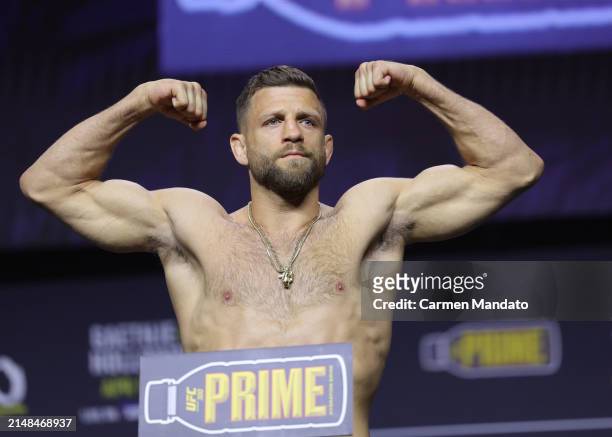 Calvin Kattar poses on the scale during the UFC 300 ceremonial weigh-in at MGM Grand Garden Arena on April 12, 2024 in Las Vegas, Nevada.