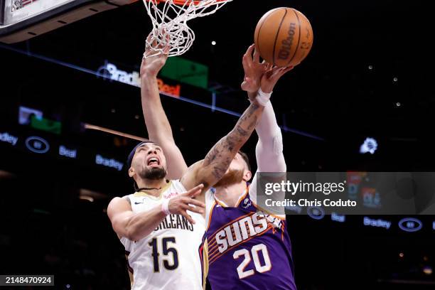 Jusuf Nurkic of the Phoenix Suns blocks a shot by Jose Alvarado of the New Orleans Pelicans during the game at Footprint Center on April 07, 2024 in...