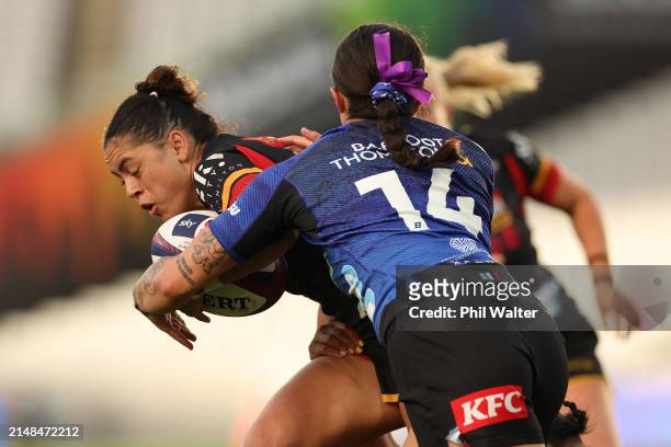 Resse Anderson of the Chiefs Manawa is tackled during the Super Rugby Aupiki Final between the Blues and the Chiefs Manawa at Eden Park on April 13,...