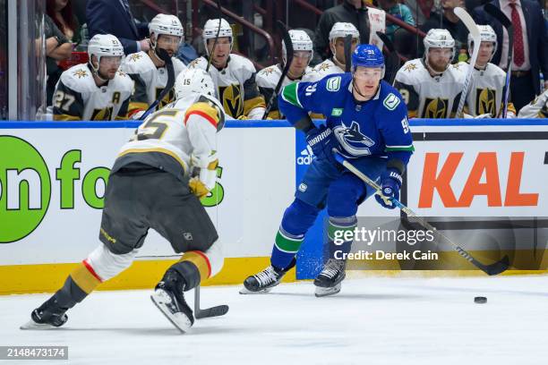 Noah Hanifin of the Vegas Golden Knights defends against Nikita Zadorov of the Vancouver Canucks during the first period of their NHL game at Rogers...