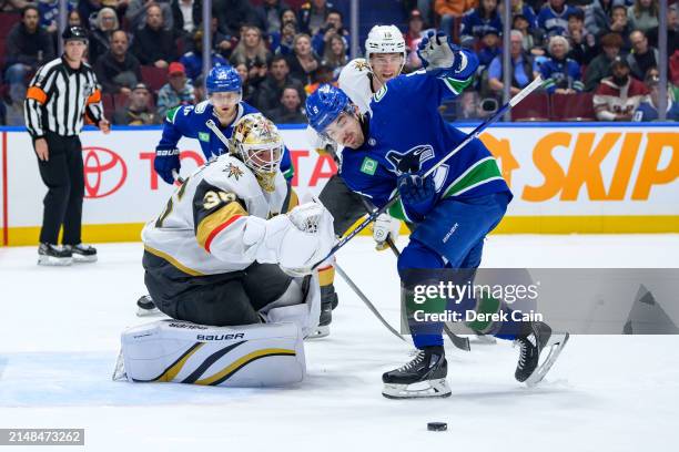 Logan Thompson of the Vegas Golden Knights makes a save on Conor Garland of the Vancouver Canucks during the first period of their NHL game at Rogers...