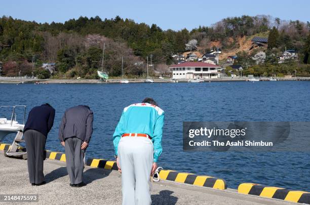 Emperor Naruhito and Empress Masako bow to commemorate the victims on April 12, 2024 in Anamizu, Ishikawa, Japan.